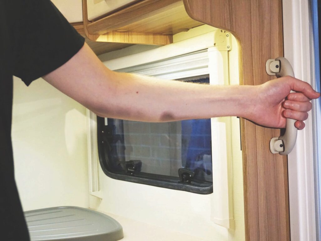 The significance of the small handles on the back of the caravan: